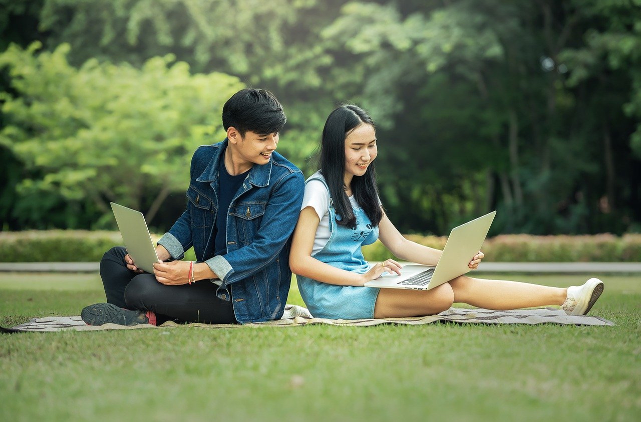 holding laptops